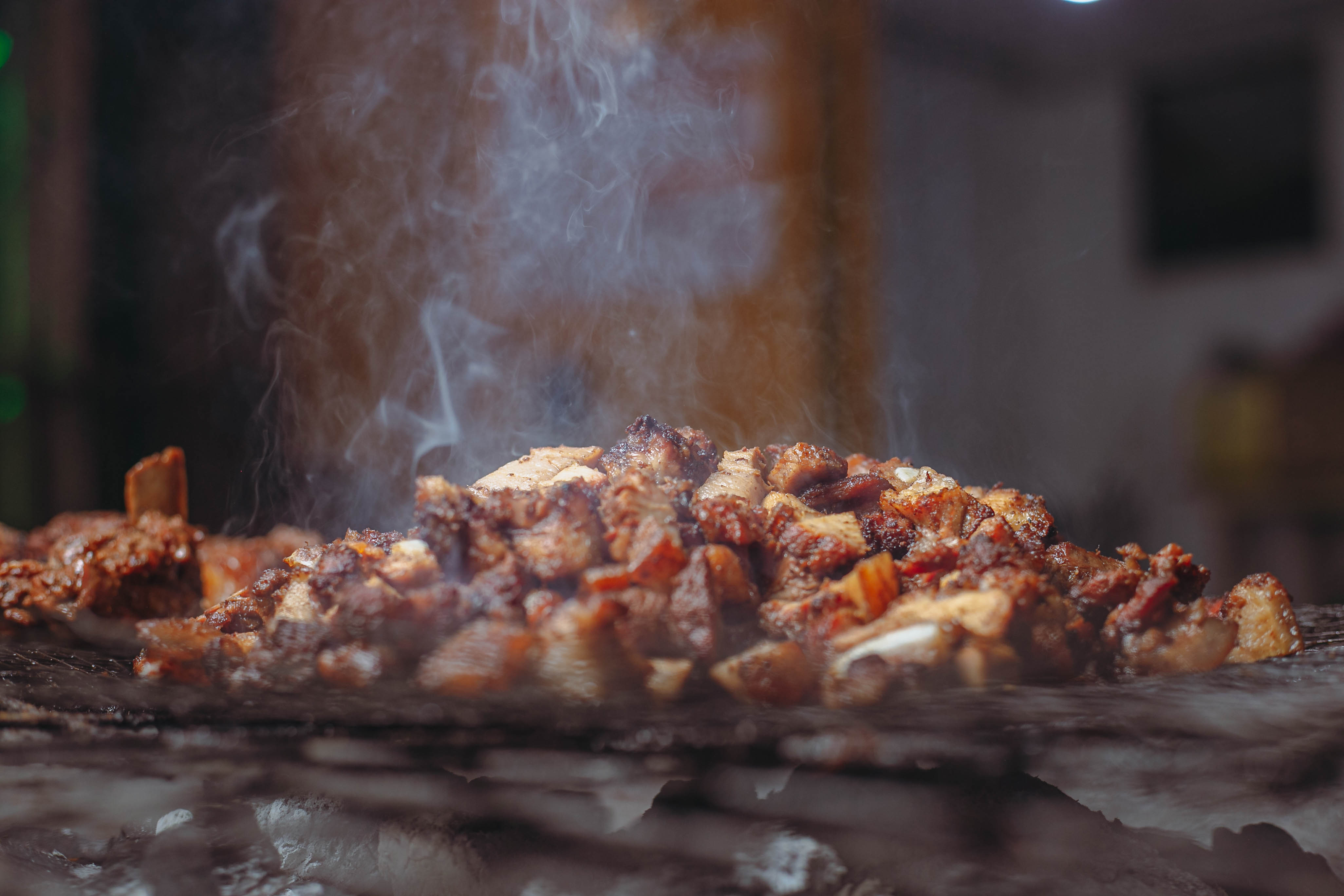 Pork sizzling on the grill